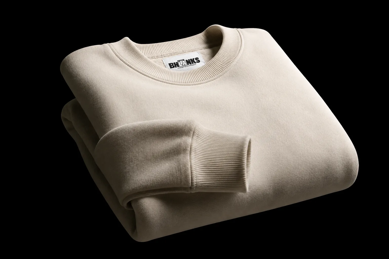 Folded cream French terry sweatshirt on black